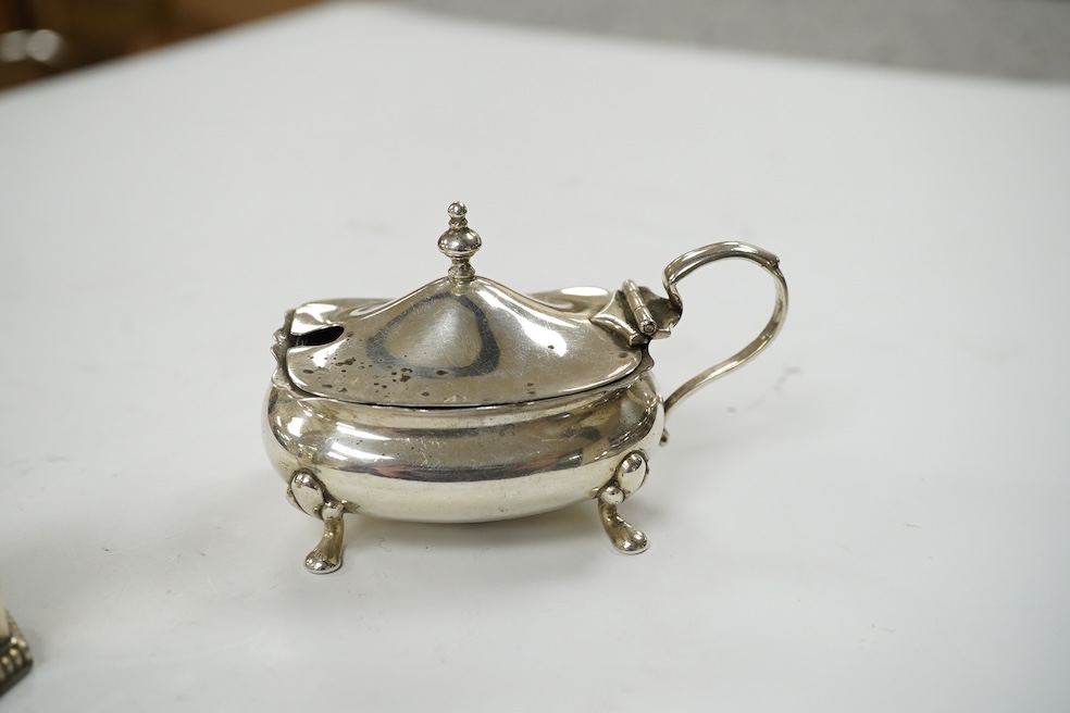 A modern silver sauceboat, 8.4oz and three silver condiments including a pair of pepperettes. Condition - fair